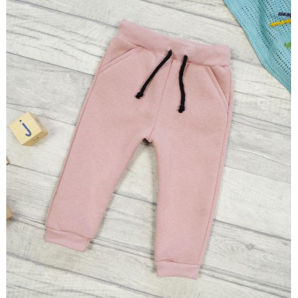 Pudrowy róż spodnie dresowe ocieplane wiązane jesień zima