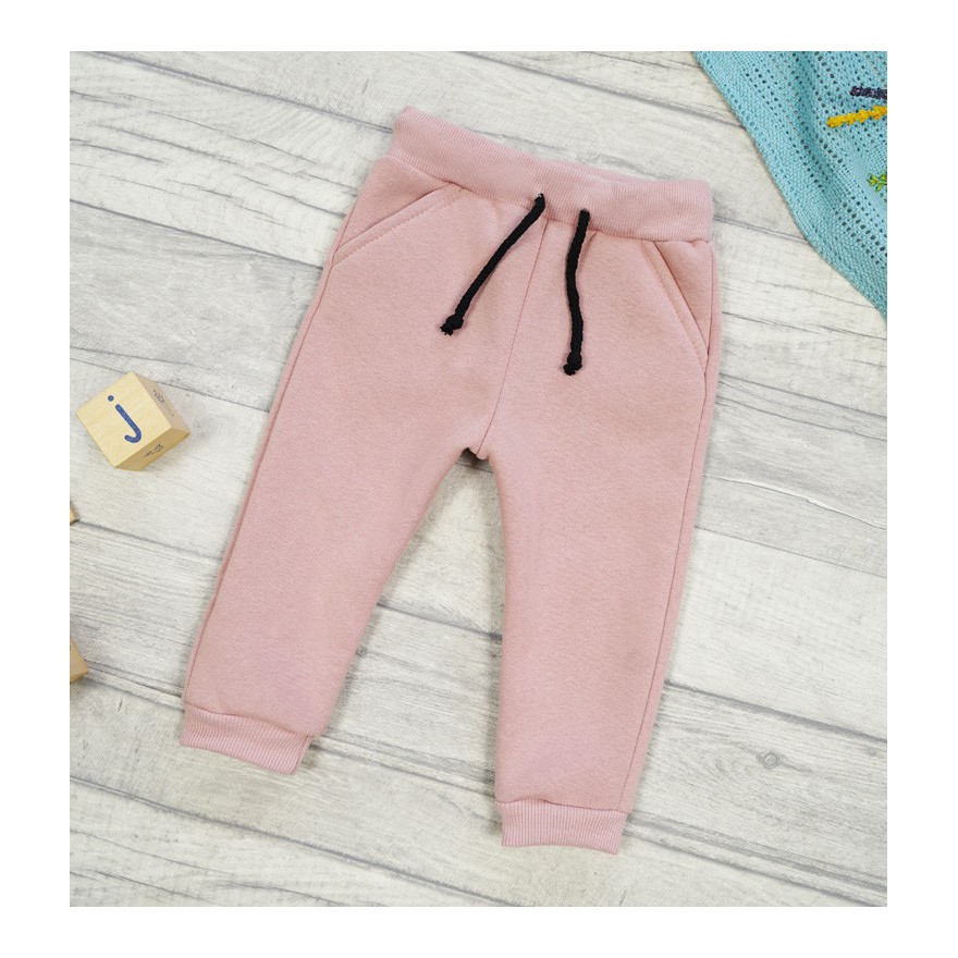 Pudrowy róż spodnie dresowe ocieplane wiązane jesień zima